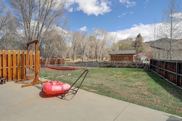 view of yard featuring a fenced backyard and a patio area