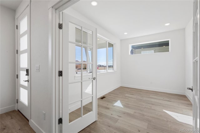 5271 Rendezvous Pkwy, Timnath, CO 80547 - doorway to outside with light wood-type flooring, baseboards, and recessed lighting