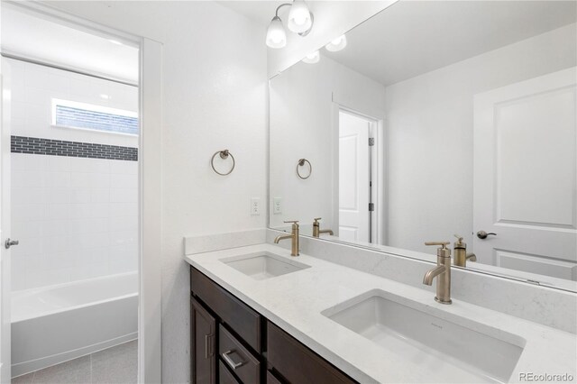 5271 Rendezvous Pkwy, Timnath, CO 80547 - bathroom with double vanity, shower / tub combination, and tile patterned floors