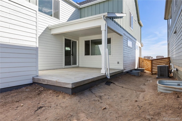 5271 Rendezvous Pkwy, Timnath, CO 80547 - back of property with board and batten siding, fence, central AC unit, and a patio area
