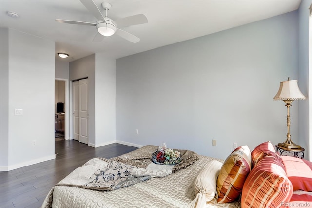 13456 Via Varra Unit 315, Broomfield, CO 80020 - bedroom with wood finished floors, baseboards, a ceiling fan, and a closet
