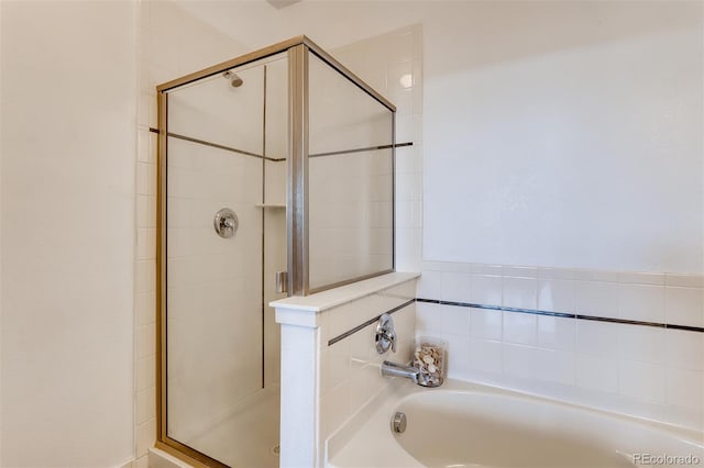 13456 Via Varra Unit 315, Broomfield, CO 80020 - bathroom with a bath and a shower stall