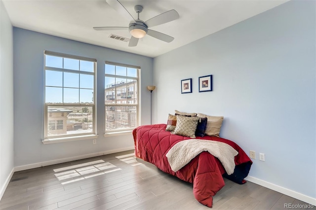 13456 Via Varra Unit 315, Broomfield, CO 80020 - bedroom with baseboards, wood finished floors, and a ceiling fan