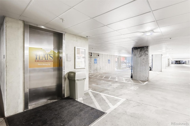 13456 Via Varra Unit 315, Broomfield, CO 80020 - hall featuring a drop ceiling and concrete floors