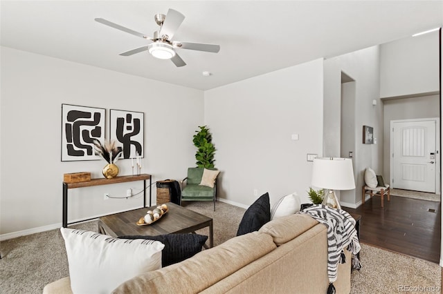 living room with ceiling fan and light carpet