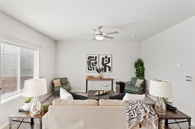 living room with ceiling fan and wood-type flooring