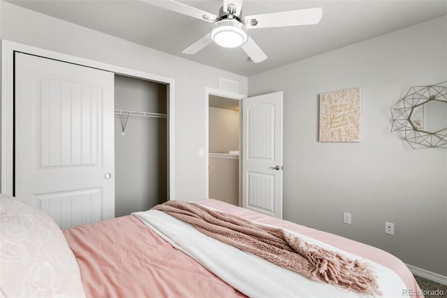 bedroom with carpet, ceiling fan, and a closet