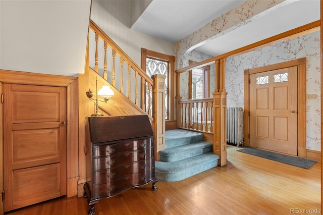 entryway featuring hardwood / wood-style flooring and radiator heating unit