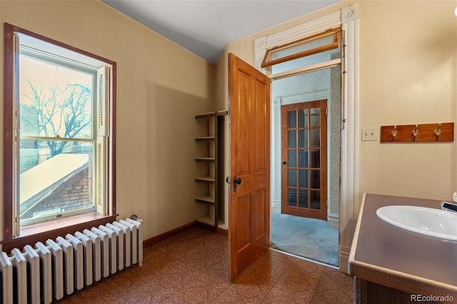 bathroom featuring sink and radiator heating unit