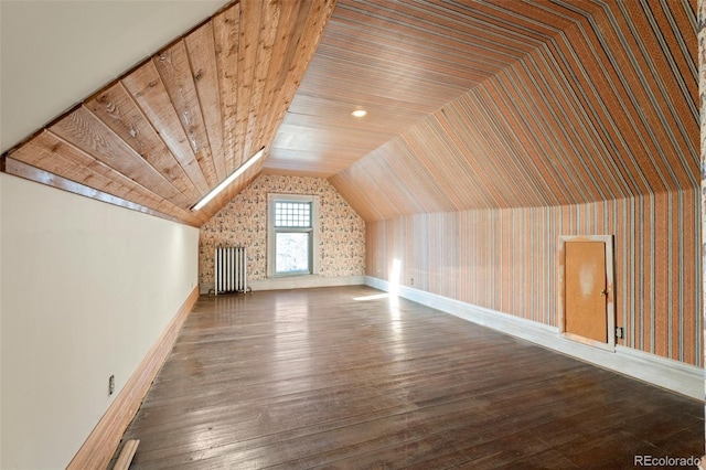 bonus room with dark wood-type flooring, lofted ceiling, and wooden ceiling