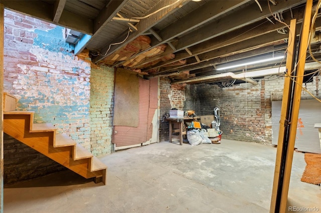 basement with brick wall