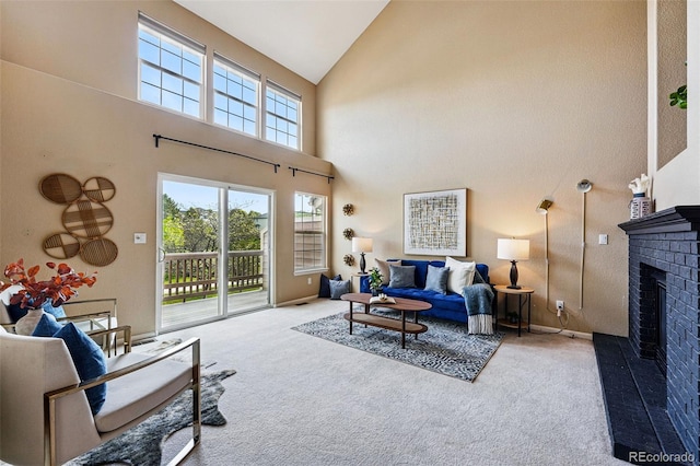 3240 W 114th Cir Unit D, Westminster, CO 80031 - carpeted living room with high vaulted ceiling, a brick fireplace, and baseboards