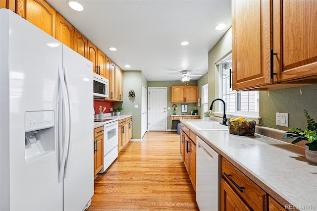 3240 W 114th Cir Unit D, Westminster, CO 80031 - kitchen with white appliances, a sink, light wood finished floors, recessed lighting, and a ceiling fan
