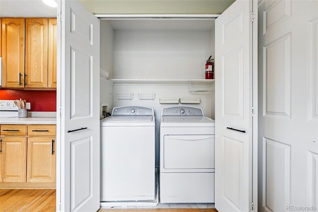 3240 W 114th Cir Unit D, Westminster, CO 80031 - laundry room with washing machine and clothes dryer and light wood finished floors