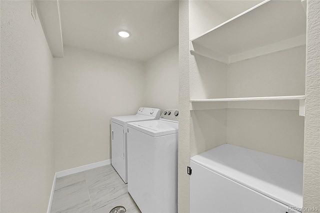 laundry area with washer and dryer