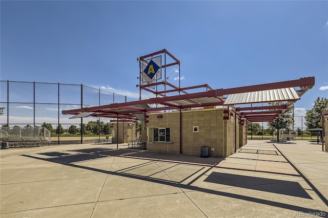 view of patio featuring a pergola and fence