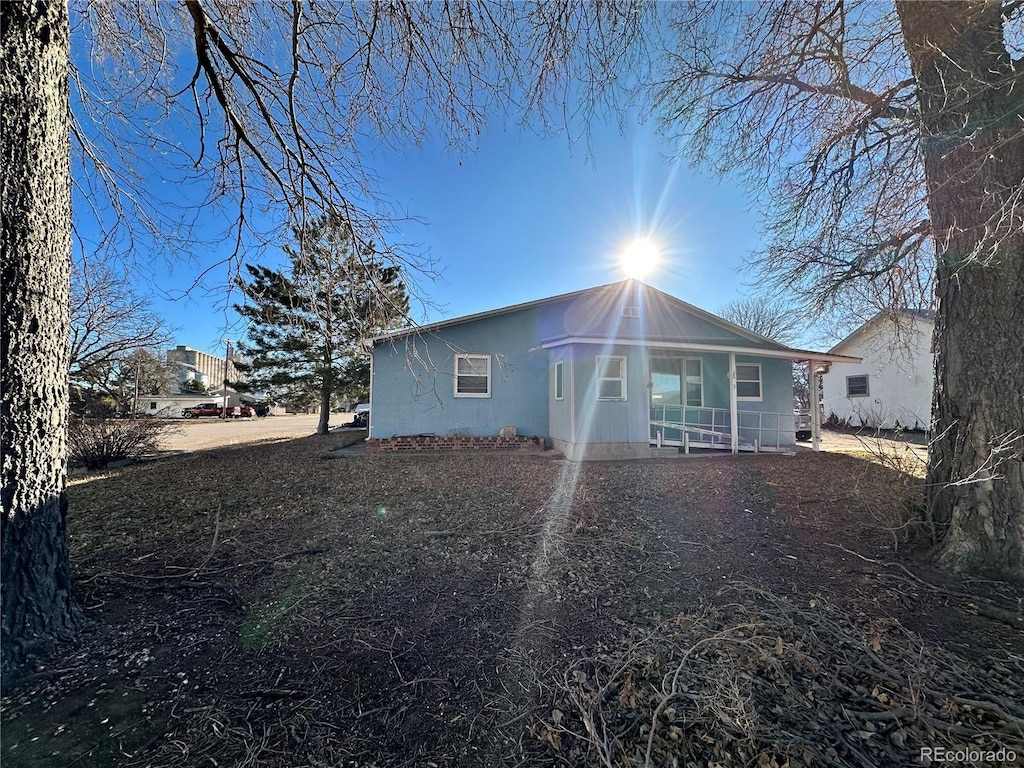 back of house with covered porch