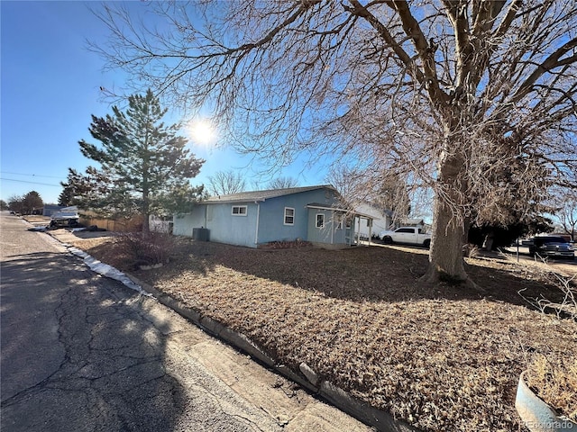 view of side of home featuring stucco siding