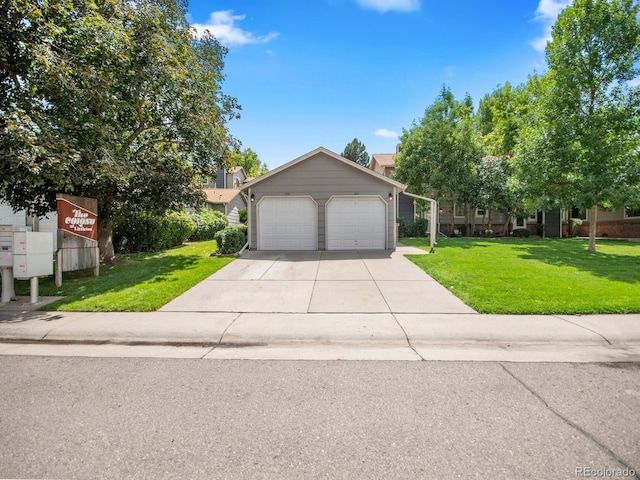 view of front of property featuring a garage and a front yard