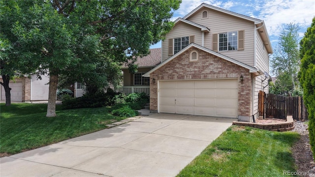 4164 E 135th Pl, Thornton, CO 80241 - view of front of property featuring brick siding, concrete driveway, and an attached garage
