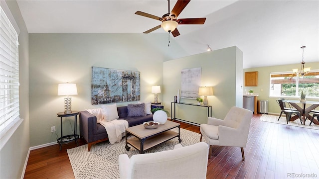 4164 E 135th Pl, Thornton, CO 80241 - living room featuring wood finished floors, a chandelier, a ceiling fan, and high vaulted ceiling