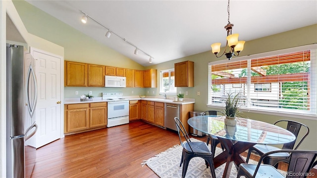 4164 E 135th Pl, Thornton, CO 80241 - kitchen with appliances with stainless steel finishes, track lighting, light countertops, a chandelier, and lofted ceiling