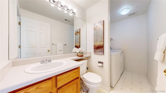 4164 E 135th Pl, Thornton, CO 80241 - bathroom featuring washer and clothes dryer and vanity
