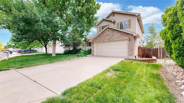 4164 E 135th Pl, Thornton, CO 80241 - view of front of home with brick siding, driveway, and a garage