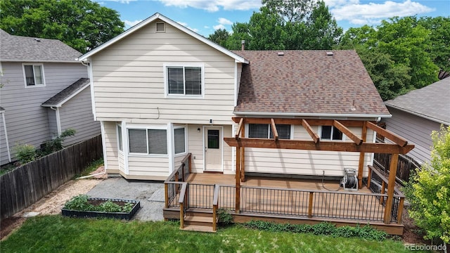 4164 E 135th Pl, Thornton, CO 80241 - back of property with a deck and roof with shingles