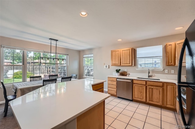1367 Teller St, Lakewood, CO 80214 - kitchen featuring stainless steel dishwasher, a sink, freestanding refrigerator, light countertops, and recessed lighting
