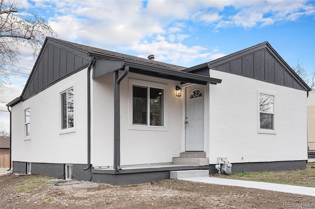 view of front of property with entry steps and board and batten siding