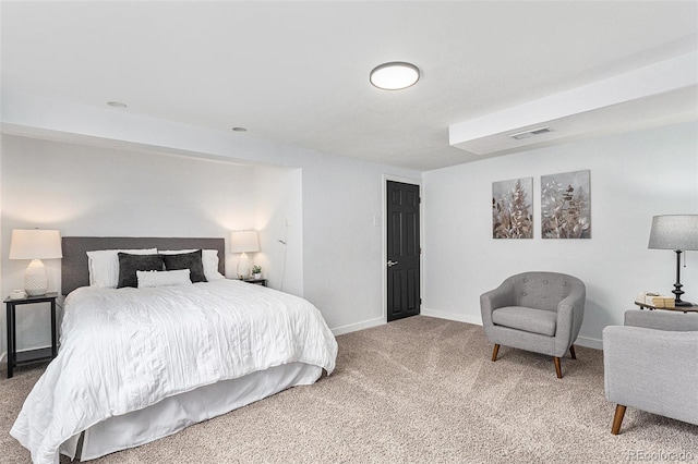 carpeted bedroom featuring baseboards