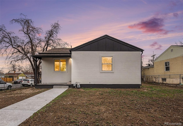 view of front of home featuring fence