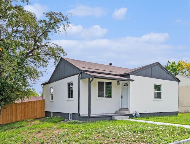 2 S Knox Ct, Denver, CO 80219 - view of front of property with board and batten siding and a shingled roof