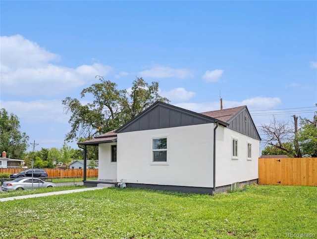 2 S Knox Ct, Denver, CO 80219 - view of property exterior featuring board and batten siding