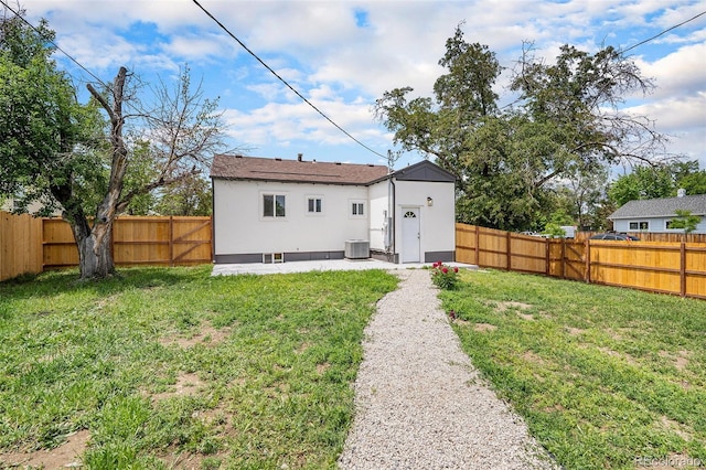 2 S Knox Ct, Denver, CO 80219 - rear view of property with stucco siding and central air condition unit