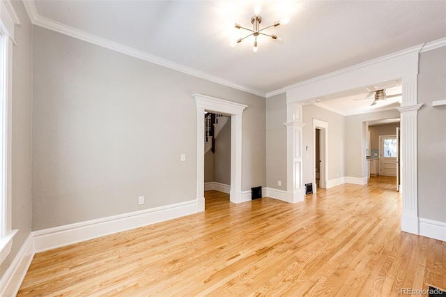 spare room featuring crown molding, ceiling fan, and light wood-type flooring