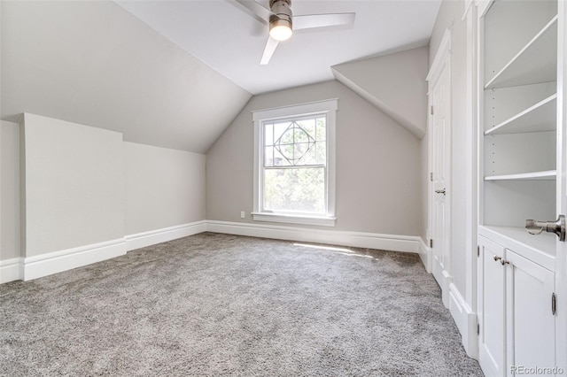 additional living space featuring lofted ceiling, ceiling fan, and carpet floors