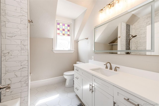 full bathroom with tile patterned flooring, toilet, tiled shower / bath, and vanity