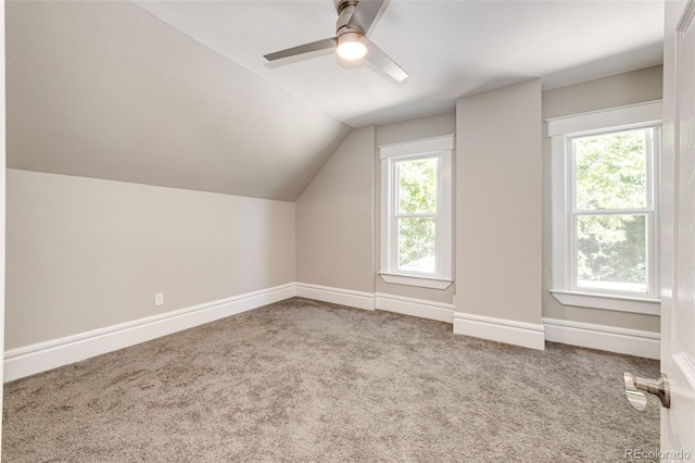 bonus room with carpet flooring, vaulted ceiling, and ceiling fan