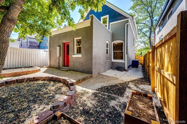 rear view of house with a patio