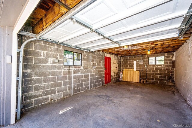 garage with concrete block wall