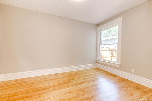 empty room with light wood-type flooring