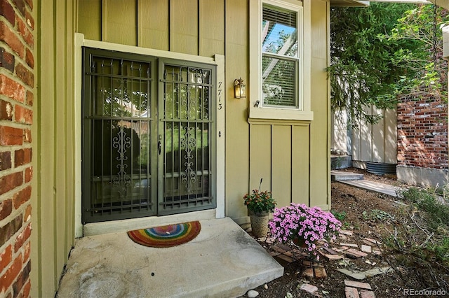 7713 E Jamison Dr, Centennial, CO 80112 - entrance to property with board and batten siding and covered porch