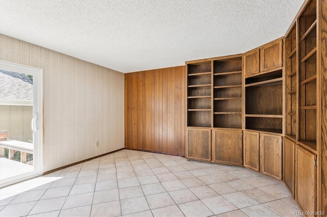 7713 E Jamison Dr, Centennial, CO 80112 - empty room with a textured ceiling and wood walls