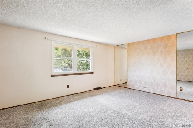 7713 E Jamison Dr, Centennial, CO 80112 - carpeted empty room featuring baseboards and a textured ceiling