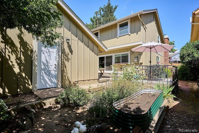 7713 E Jamison Dr, Centennial, CO 80112 - back of property with a garden and board and batten siding