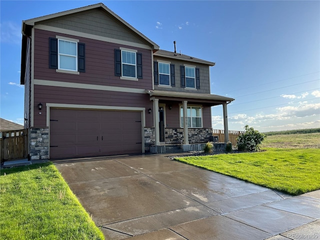 975 Alta St, Lochbuie, CO 80603 - view of front facade with a porch, stone siding, a front lawn, a garage, and concrete driveway