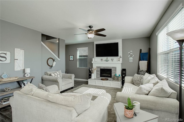 975 Alta St, Lochbuie, CO 80603 - living room with ceiling fan, a tile fireplace, and wood finished floors