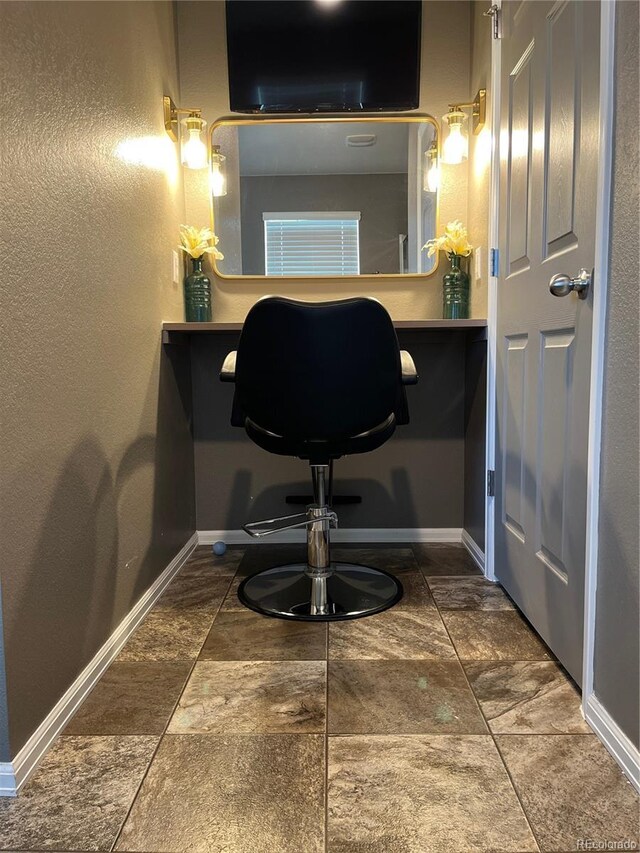 975 Alta St, Lochbuie, CO 80603 - bathroom featuring baseboards and stone finish floors